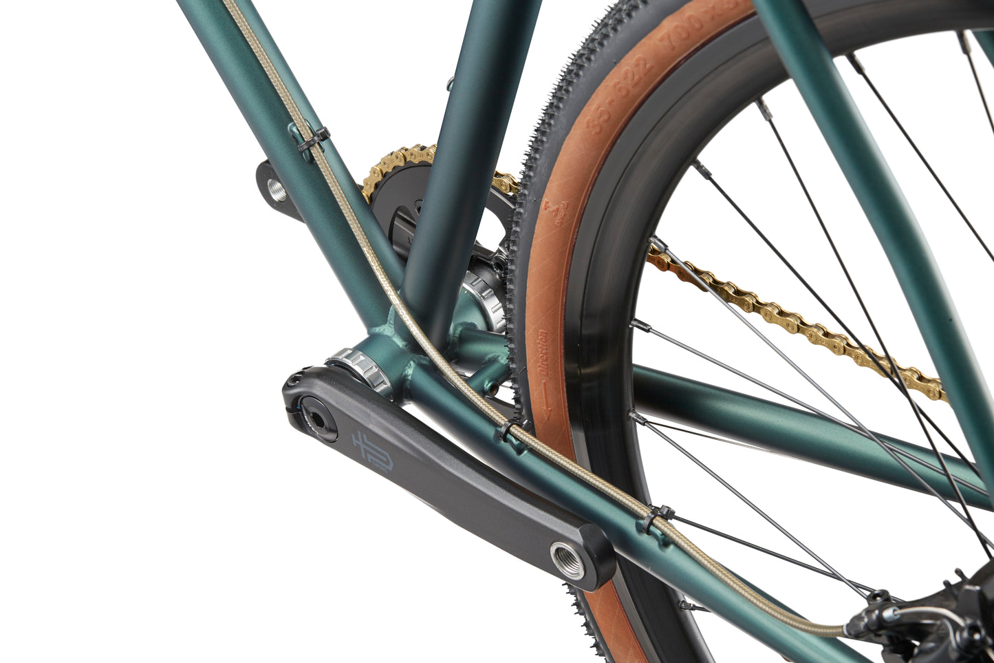 Close-up of CATALINA 2s green chromoly frame, rear wheel, crank, and tan sidewall tire—an ideal urban companion.