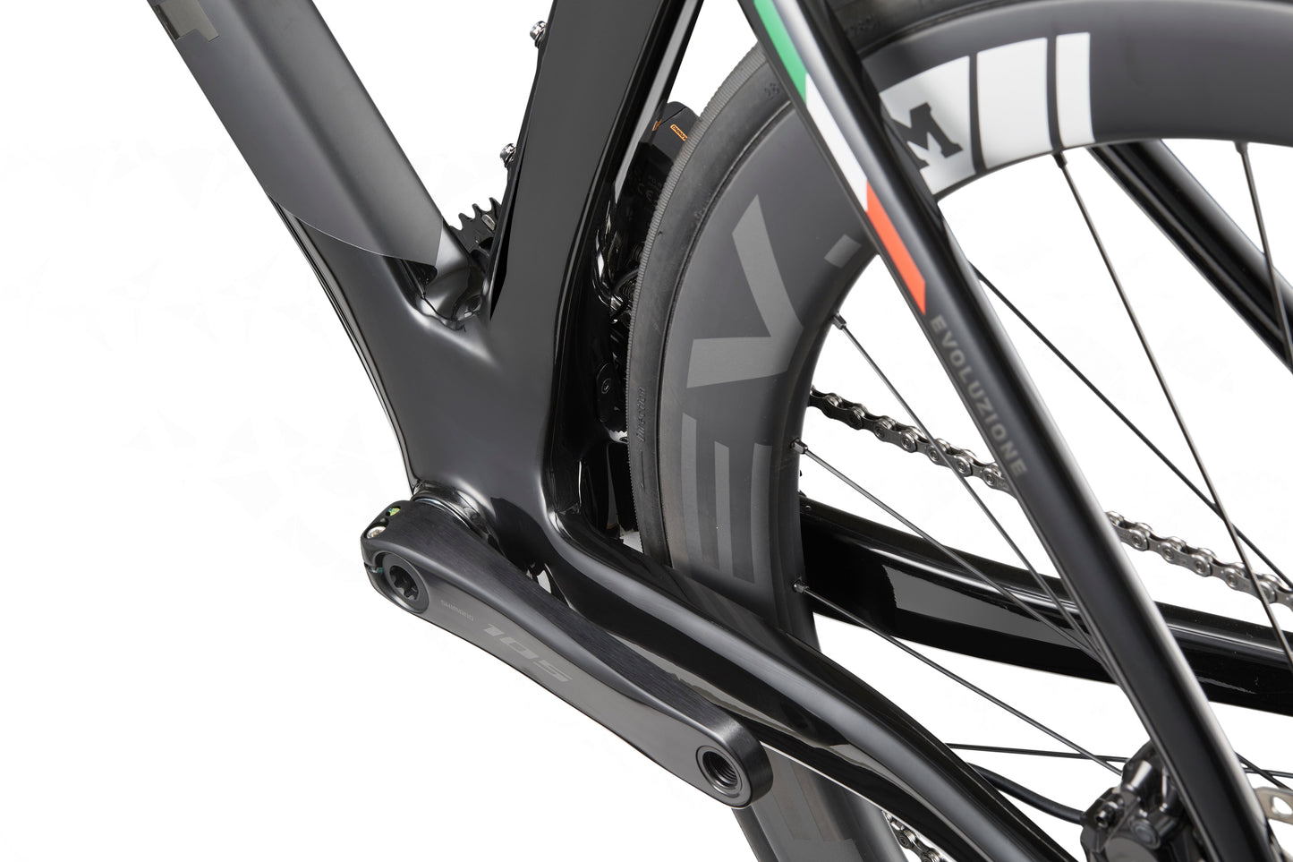 Close-up of the rear wheel and frame of a Masi EVOLUZIONE 1, highlighting its aerodynamic design and detailed tire branding.
