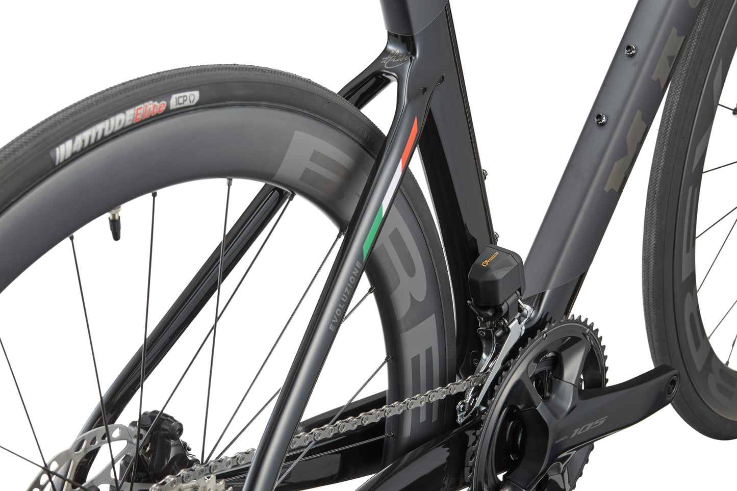 Close-up of the EVOLUZIONE 1s rear wheel and frame, showcasing aerodynamic design with disc brakes and visible chain mechanism.