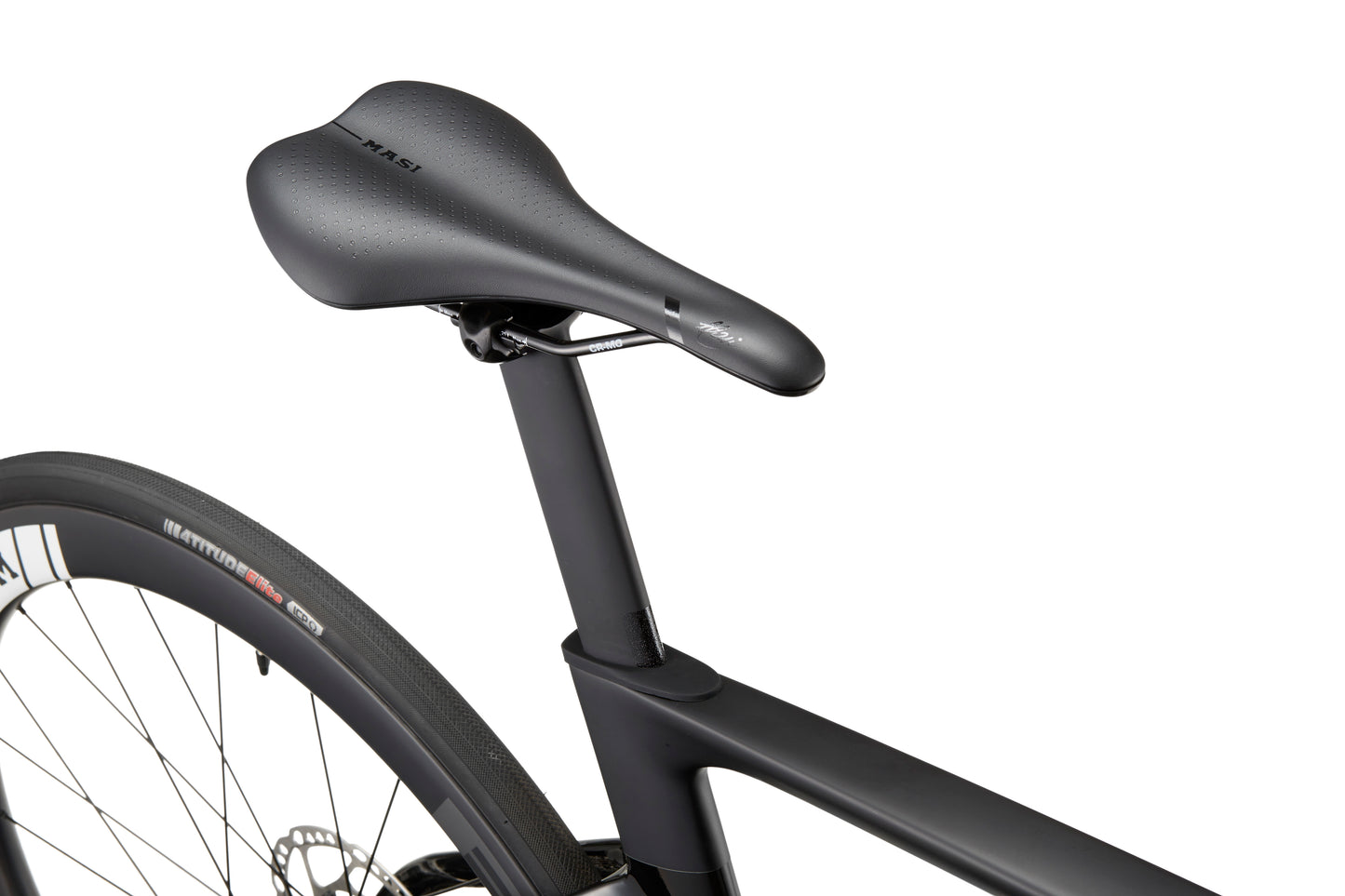 Close-up of a sleek black saddle on an EVOLUZIONE 1, highlighting its rear wheel and part of the aerodynamic carbon frame.
