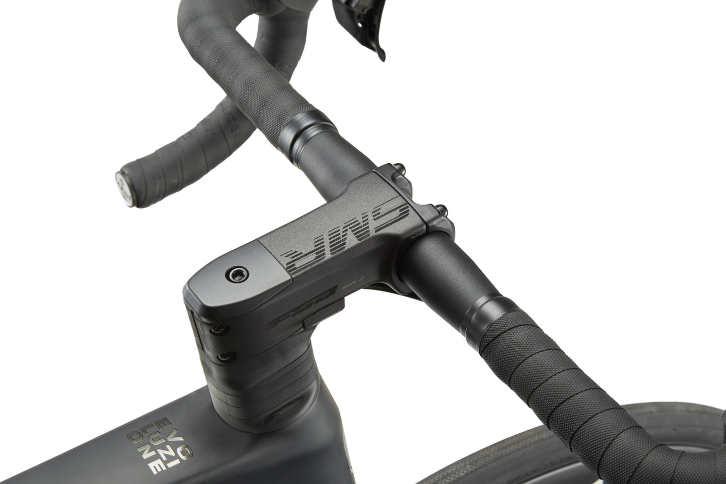 Close-up of the EVOLUZIONE 1 black handlebar with textured grips, integrated brake levers, and an aerodynamic design. ONE is on the stem.