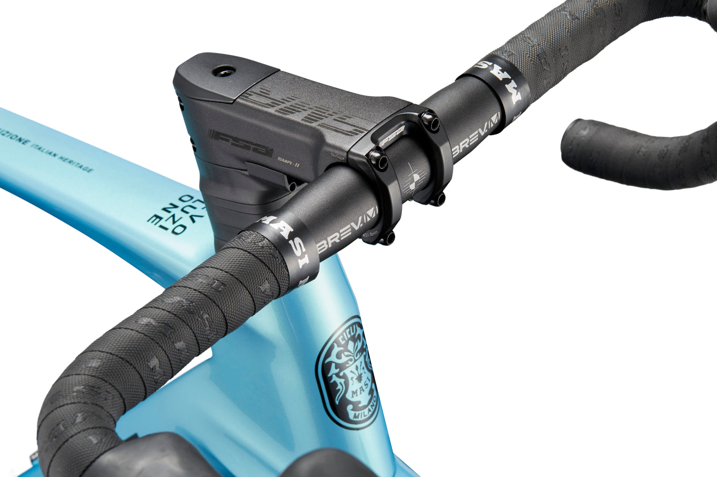 Close-up of modern road bike handlebars with textured black grips and a sleek blue frame, showcasing EVOLUZIONE 1 Carbon branding details.