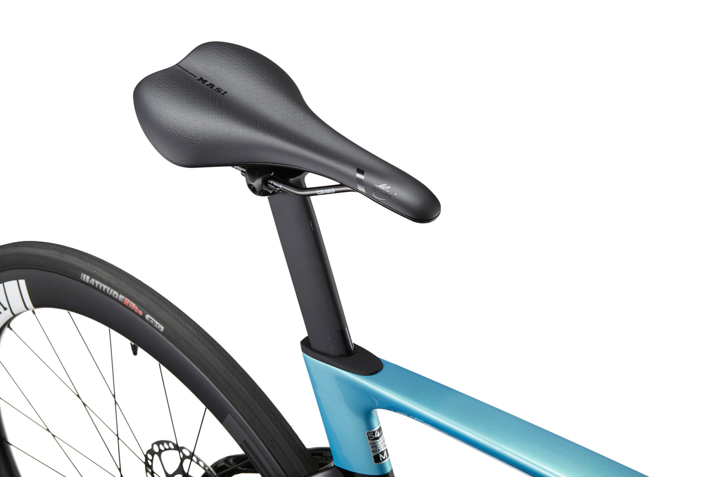 Close-up of the EVOLUZIONE 1s seat and rear wheel, showcasing the aerodynamic design of this sleek racing bike saddle and tire.