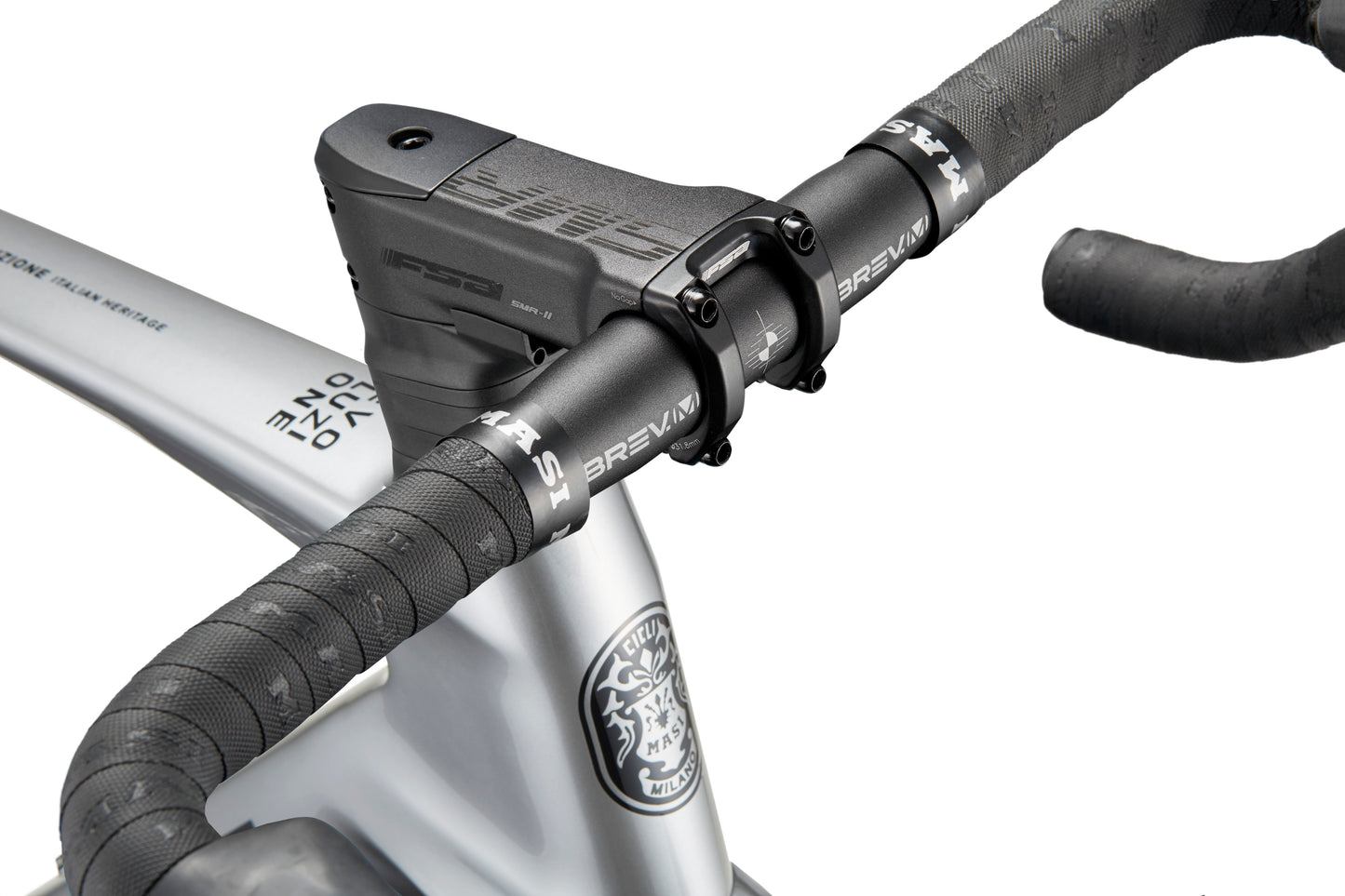 Close-up of an EVOLUZIONE 1 bike with black handlebars and stem on a grey frame, logo prominently visible.