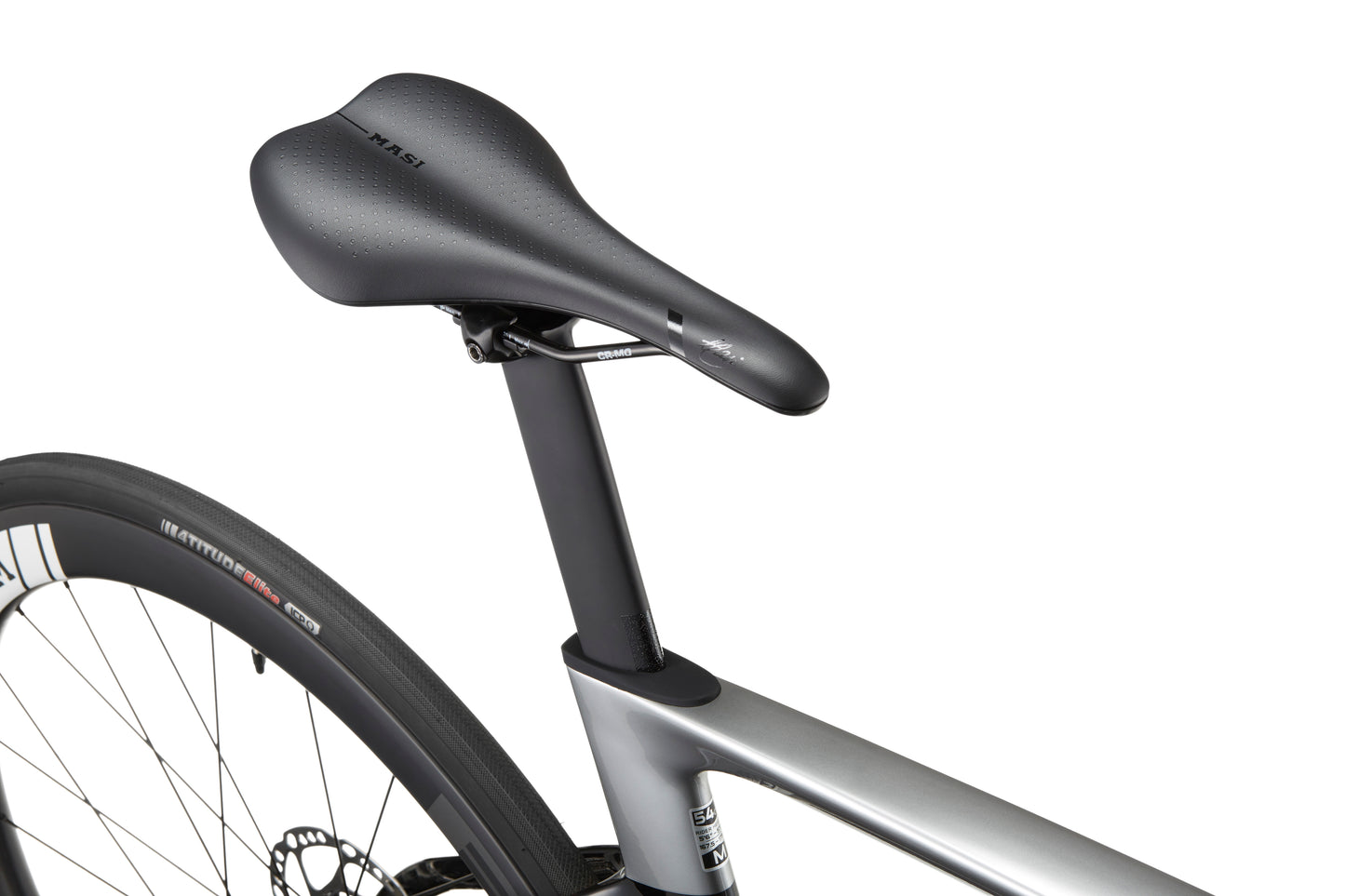 Close-up of a black bicycle saddle and seat post on the sleek EVOLUZIONE 1 Carbon, highlighting its aerodynamic design near the rear tire.