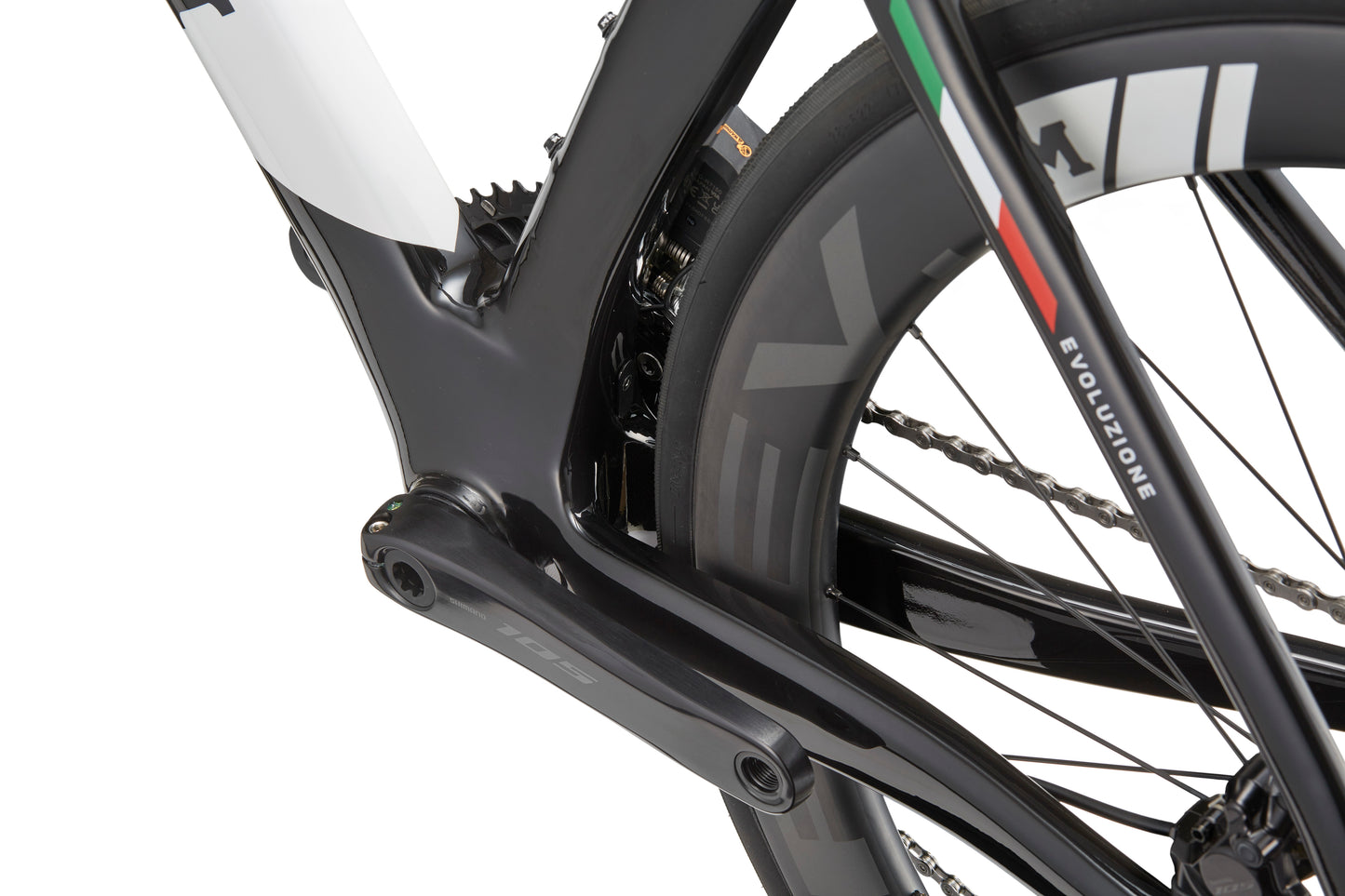 Close-up of EVOLUZIONE 1, showcasing its aerodynamic road bike frame with focus on crankset and rear wheel.