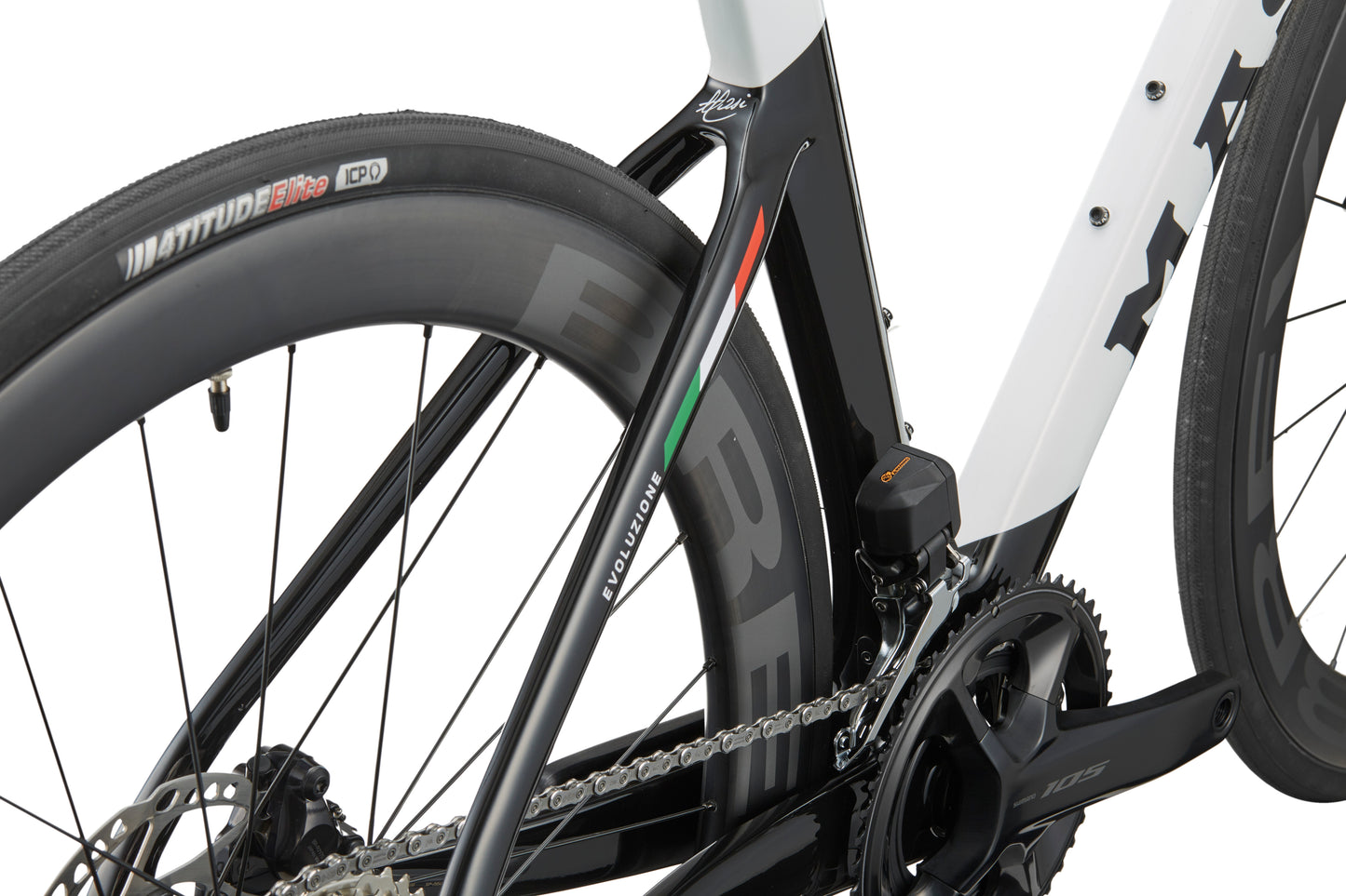 Close-up of the EVOLUZIONE 1 frame, showcasing its aerodynamic design with rear tire, chain, and Italian flag detail.