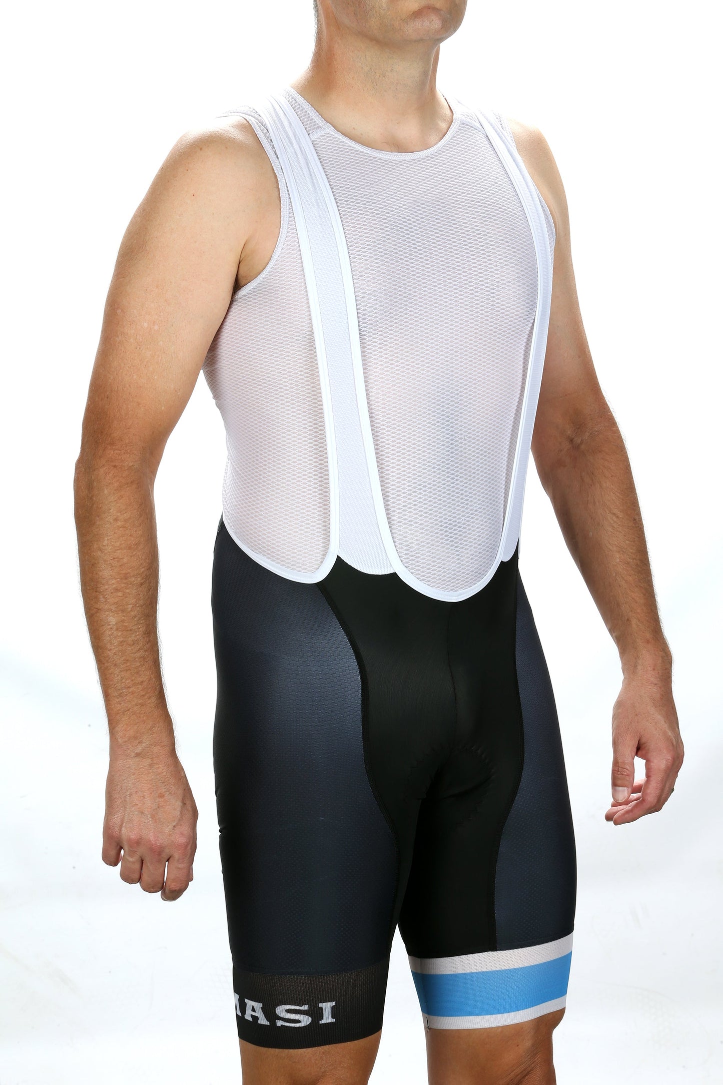 A person wearing a white mesh cycling bib top and MASI LEGACY CX BIBS by Masi Bikes stands against a white background, highlighting their aerodynamic design with blue and white striped black shorts on the left leg.