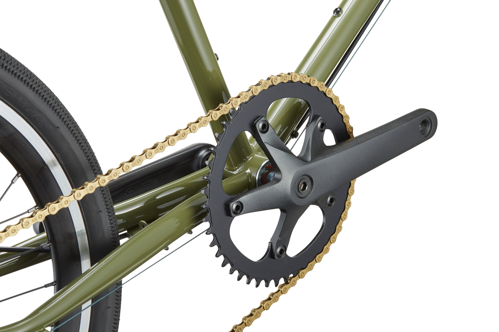 Close-up of STELVIO 2s crankset, chainring, and golden chain on a green MiniVelo frame with Italian design flair.