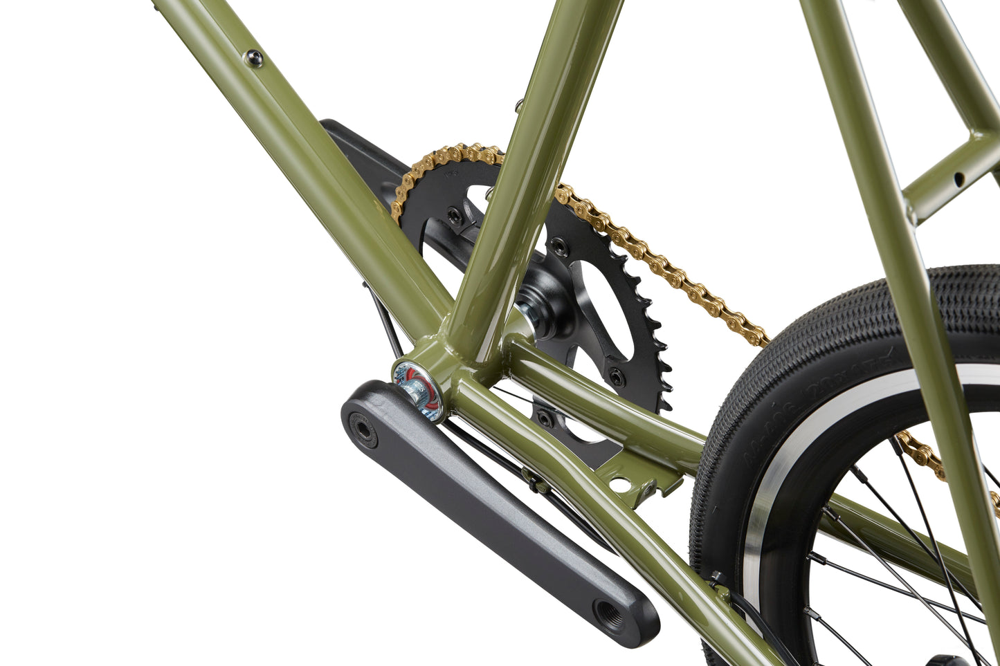 Close-up of the STELVIO 2 green MiniVelo frame, chain, pedals, and rear tire against a white background.
