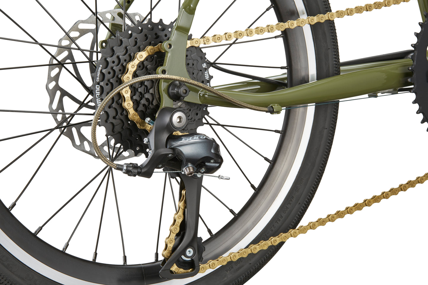 Close-up of STELVIO 2s rear wheel: gears, gold chain, derailleur, and disc brake on a green urban MiniVelo frame.