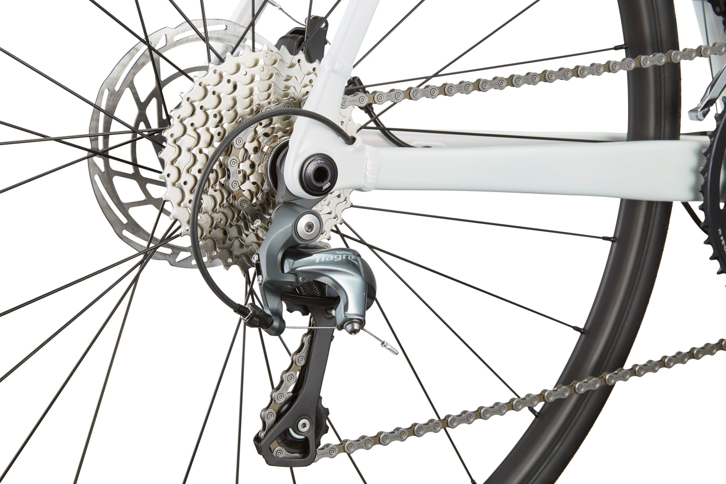 Close-up of the VINCERE 3s Shimano Tiagra rear derailleur, chain, gear system, and disc brake.
