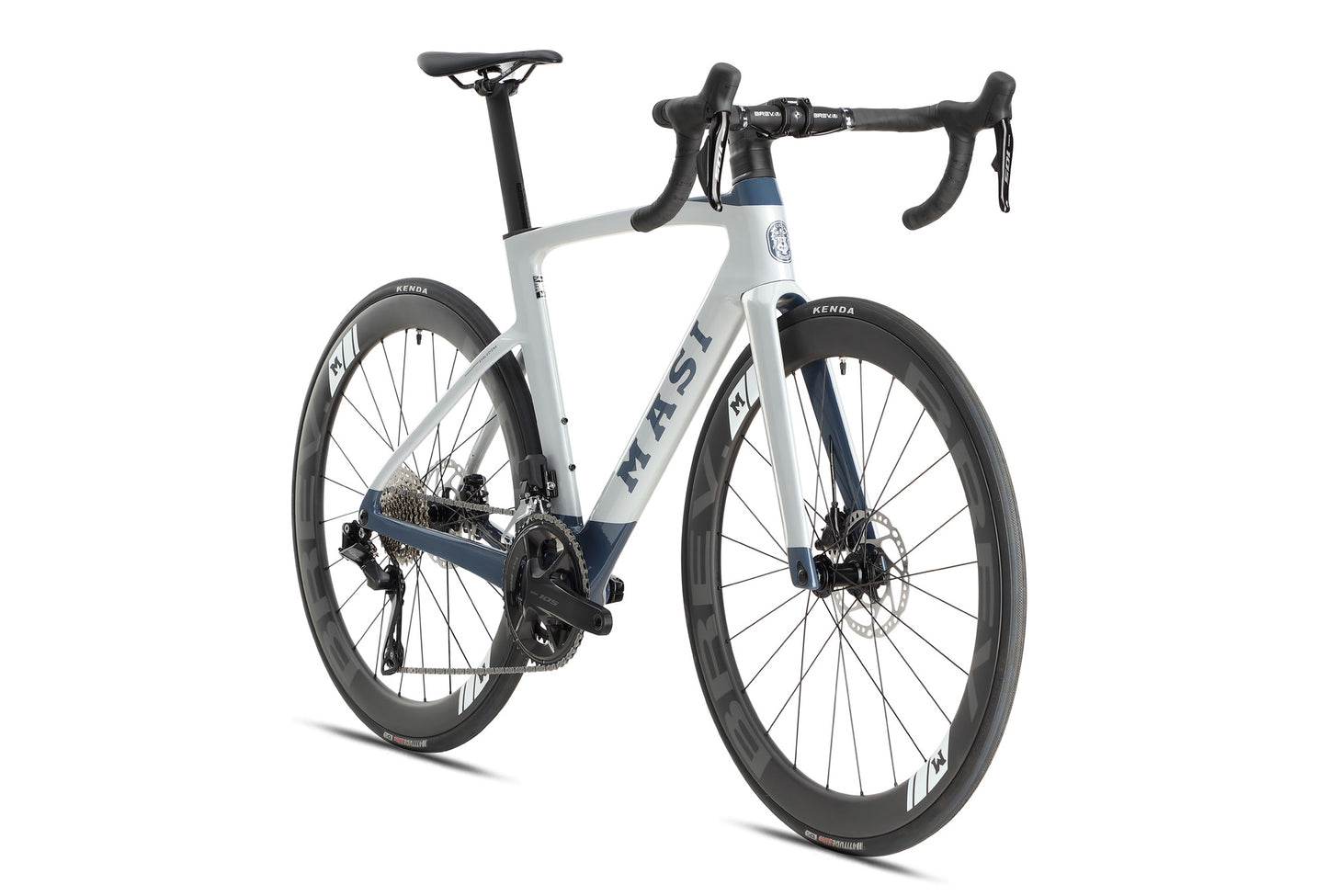 The Masi Bikes EVOLUZIONE 1 is a contemporary road bike featuring an aerodynamic design in white and blue. It includes drop handlebars, deep-profile wheels with disc brakes, and KENDA-branded tires.