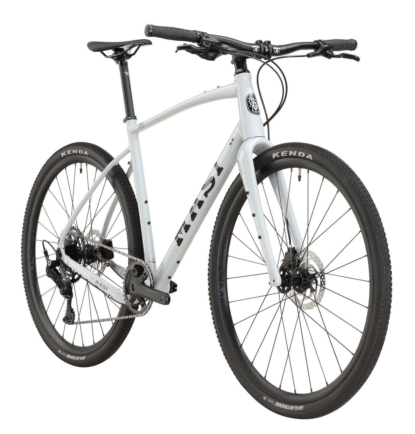 The BRUNELLO 3 is a white hybrid bike with alloy frame, black handlebars, disc brakes, and Kenda tires on a white background.