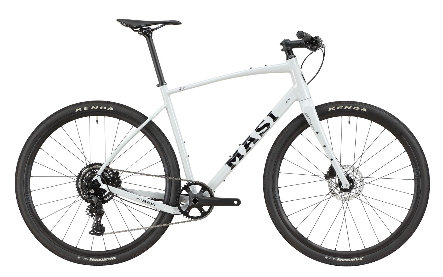 The BRUNELLO 3 is a light gray Masi gravel bike with an alloy frame, tubeless-ready wheels, disc brakes, and a flat handlebar.