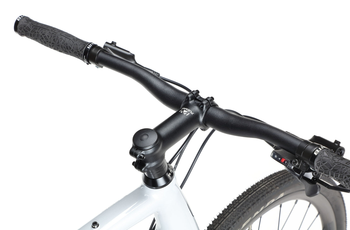 Close-up of the BRUNELLO 3 gravel bike’s black handlebar, stem, and front tire against a white background.