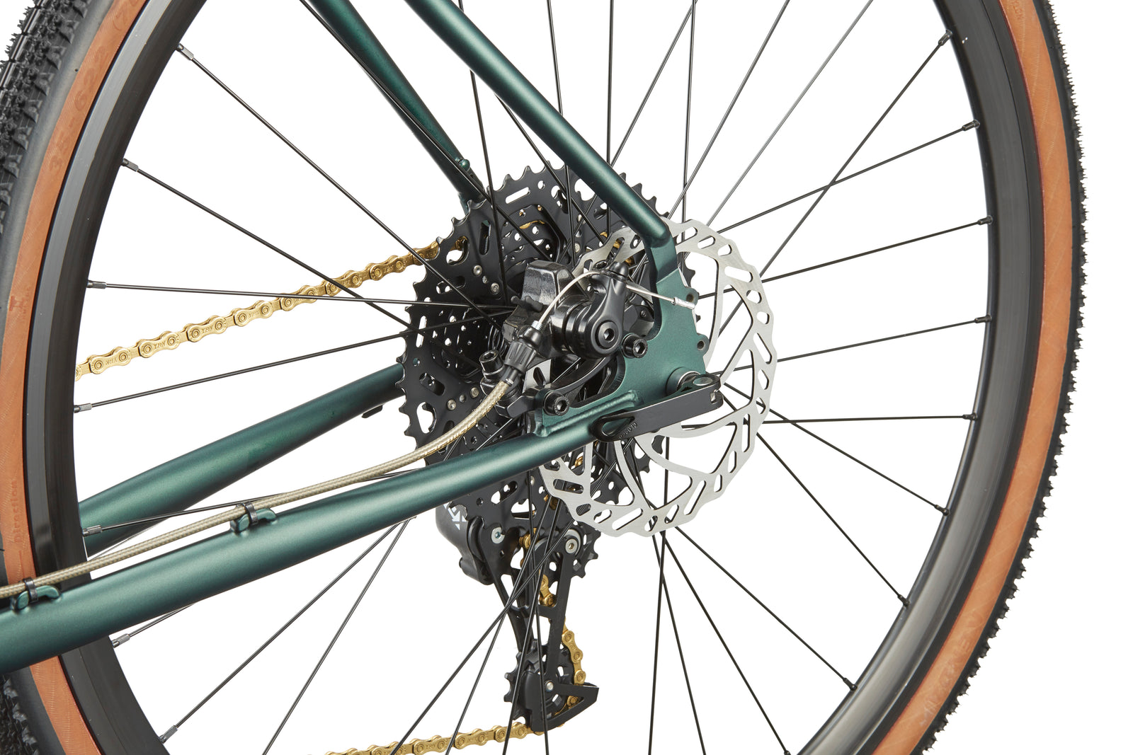 Close-up of the CATALINA 1 bicycle’s rear wheel, highlighting gears, chain, disc brake rotor, and derailleur on a white background.