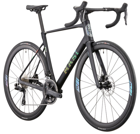 Matte black GRAN CORSA carbon road bike with drop bars, disc brakes, aero frame, and thin tires seen from a front-side angle.