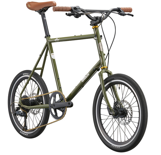The STELVIO 2 is a green MiniVelo urban bike with Italian design, brown seat/handlebars, black tires, and disc brakes.