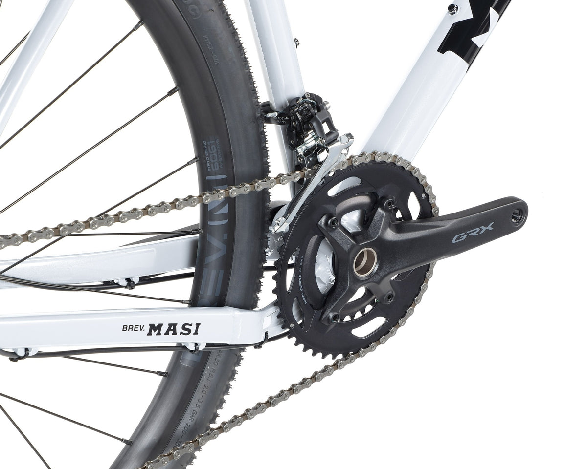 Close-up of the BRUNELLO 1 bike with GRX crank arm, alloy frame, and tubeless-ready wheels for gravel racing.