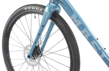 Close-up of BRUNELLO 1’s front wheel and fork with tubeless-ready Kenda tire, disc brake, and MASI branding.
