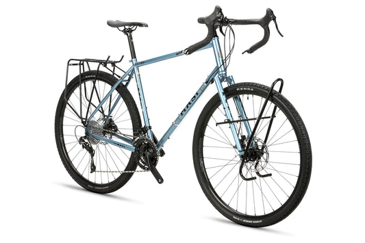 The Masi Bikes GIRAMONDO 700c touring bike boasts drop handlebars, front and back luggage racks, sturdy black Kenda tires, and disc brakes, making it ideal for long-distance adventures.