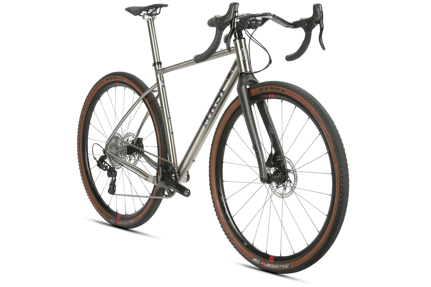 Masi Bikes presents the INCANTO CAMPY EKAR Ti, a titanium gravel bike with a sleek minimalist design featuring drop handlebars, disc brakes, a black fork, and brown-treaded tires. Enhanced by the Campagnolo EKAR 13 speed system, it showcases prominent brand markings from an angled view.